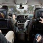 Family in Car Using Uconnect entertainment screens