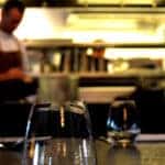 Well-lit restaurant with glasses on the table