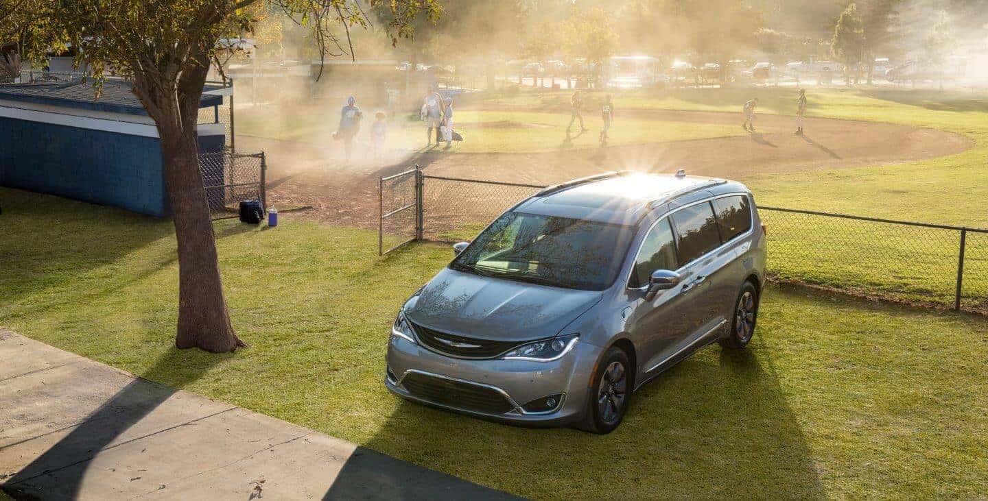 2018 Chrysler Pacifica parked by a baseball field