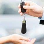 Handing over key to car