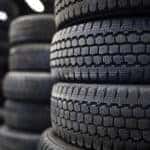 Tires for sale at a tire store - stacks of old used tires