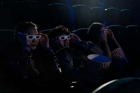 people watching a movie in a theater