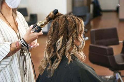 woman getting a haircut in louisville, KY