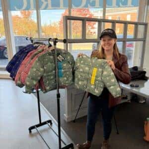 Team member with the coats