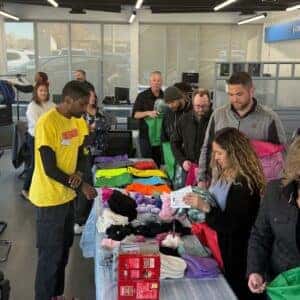 team member packing backpacks