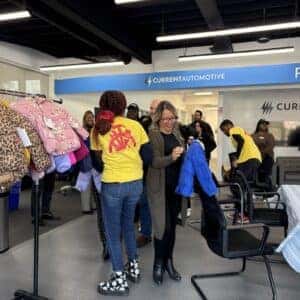 team members choosing coats