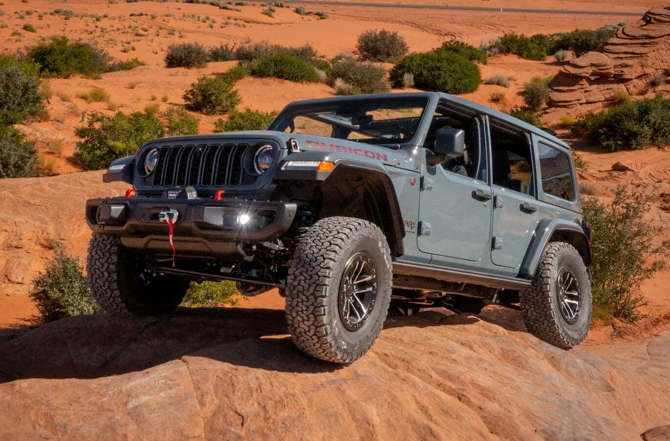 Jeep Wrangler Rubicon off-roading in rocky terrain