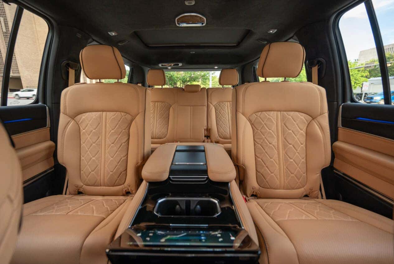 Interior view of a Jeep Grand Wagoneer three-row cabin in Tupelo leather.