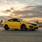The exterior view of the left side of the phoenix yellow 2021 Limited Edition Honda Civic Type R