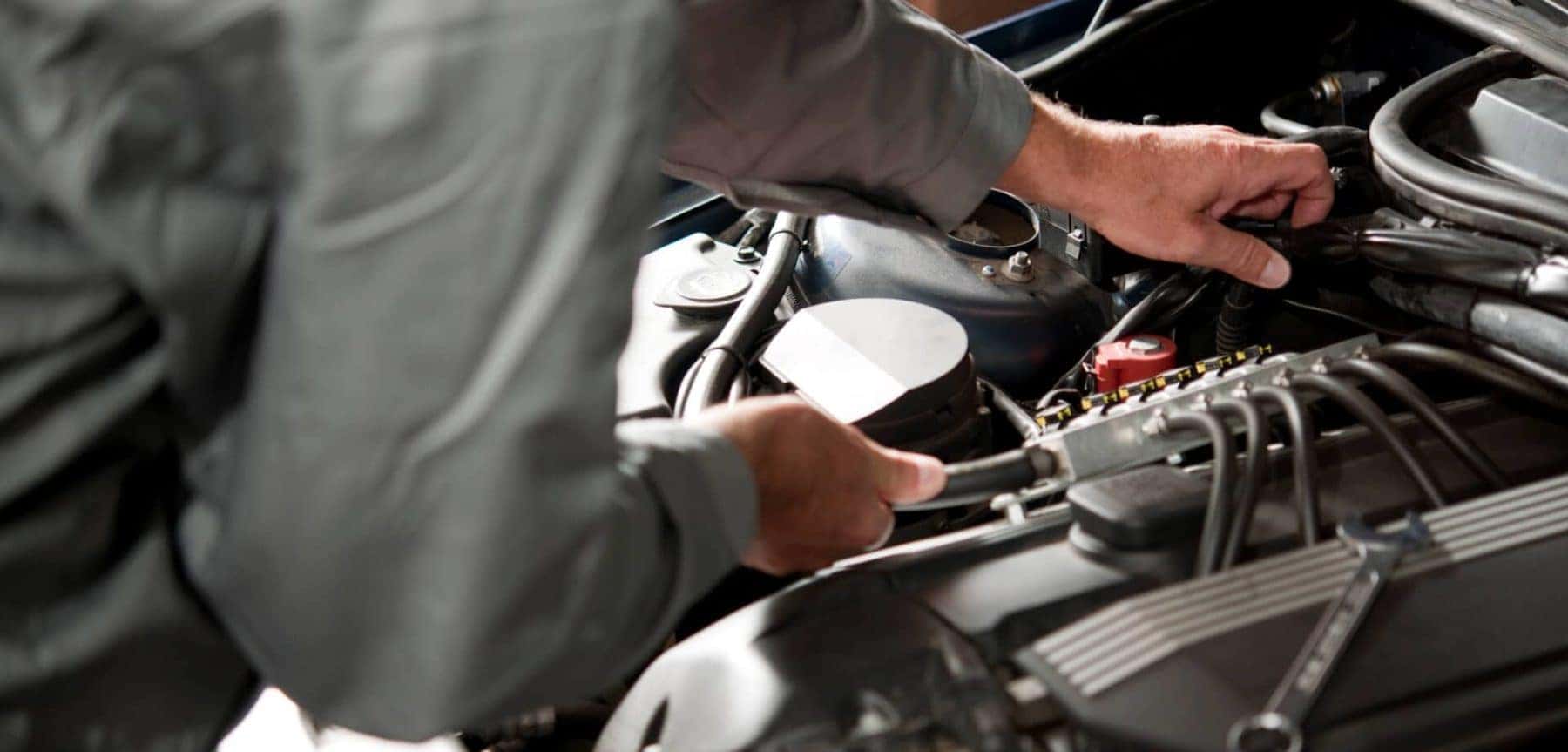 technician inspecting an engine