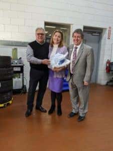 Our Marketing Director, Pamela Marshall, is not keen on her picture, but she was happy to receive her Thanksgiving turkey! She is pictured with GM, Larry Powell (left) and Circle BMW President, Tom DeFelice (right).