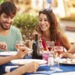 Friends Eating at Fine Restaurant Outside