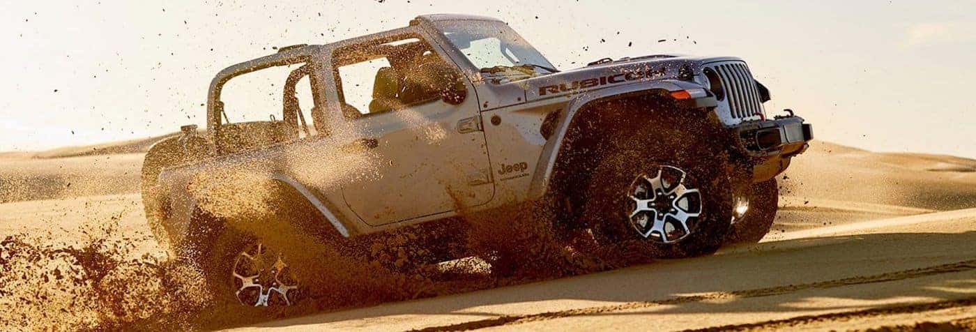 https://di-uploads-pod13.dealerinspire.com/cornerstonechryslerdodgejeepram/uploads/2019/12/A-2020-Jeep-Wrangler-Off-Roading-in-a-Desert.jpg