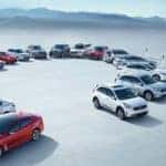 2018 Kia Model Lineup in a circle in front of Mountains