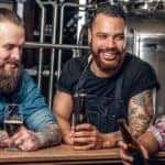 Three men at micro brewery