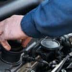 Auto Service Technician Checking Engine