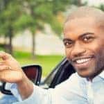 Happy new car driver holding keys
