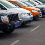 Cars parked in a row outside.
