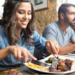 Couple having lunch at rustic gourmet restaurant