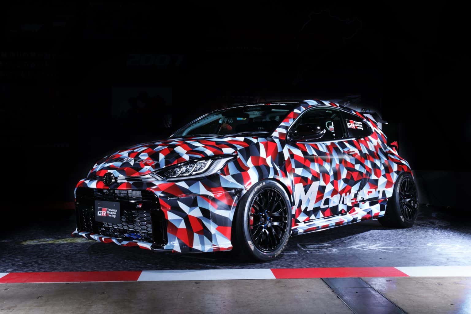 Camouflaged Toyota GR Yaris M Concept viewed from the front left
