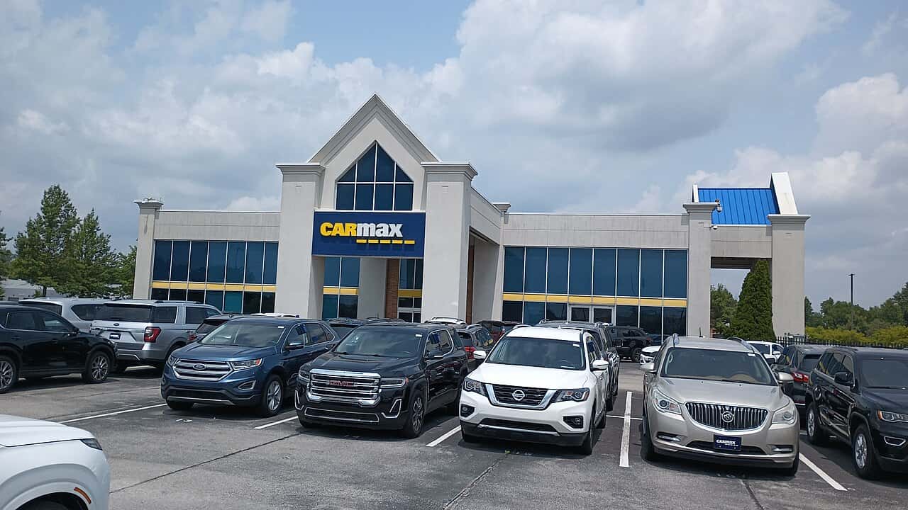 CarMax dealership exterior and parked vehicles in Carmel, photographed July 2023.