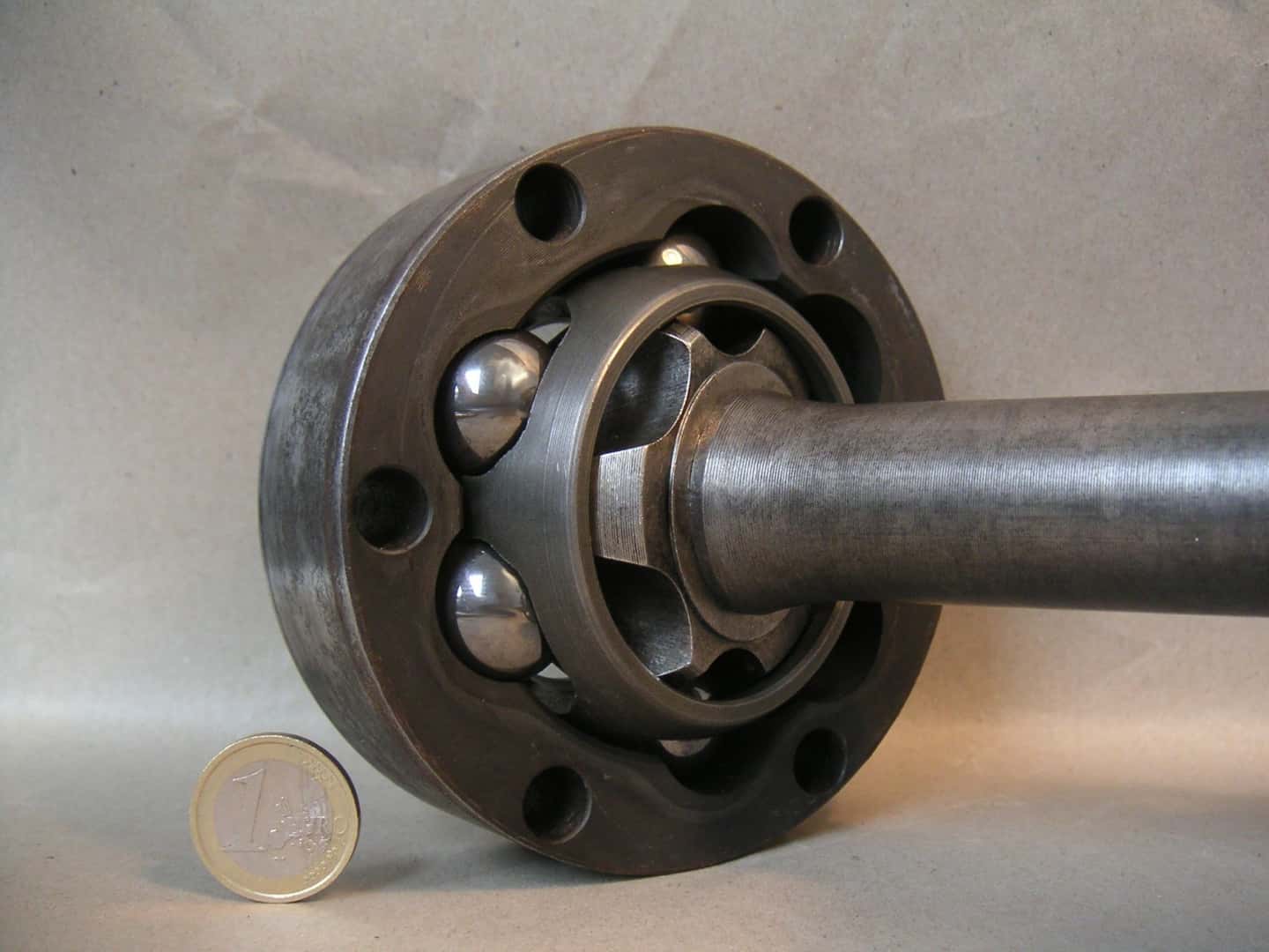 Exposed ball-and-cage CV joint on a BMW rear-axle shaft