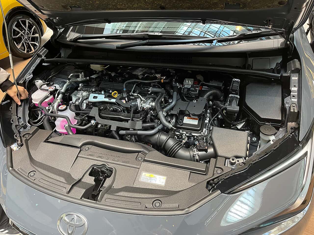 Engine bay of a Toyota Prius Z 2WD (MXWH60) with the hood open.