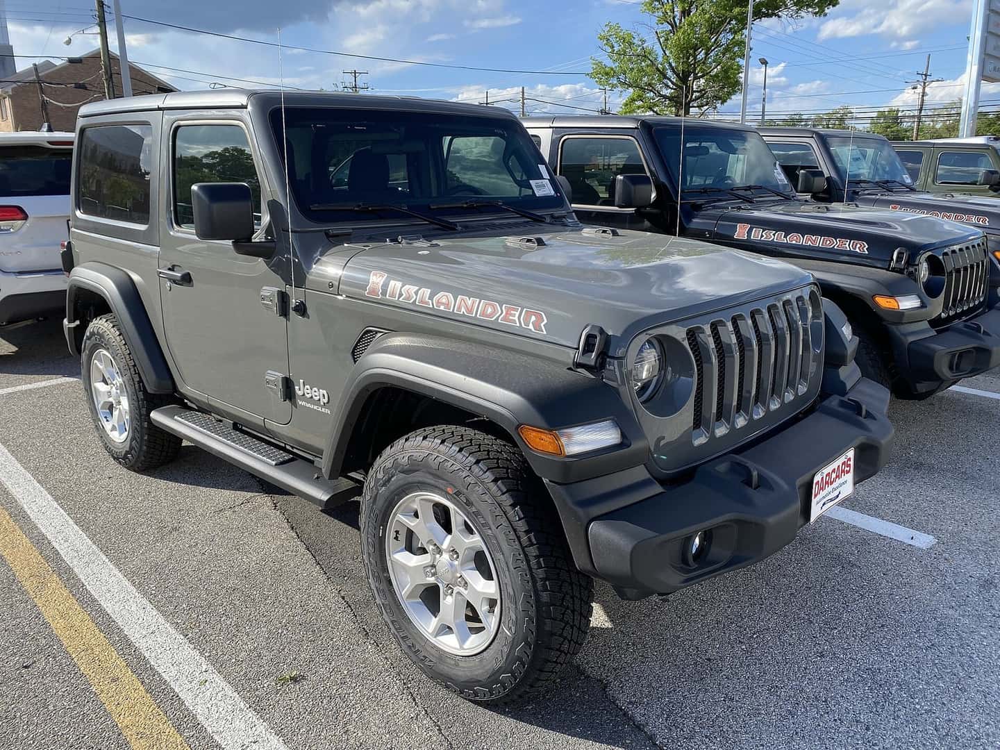 Gray 2021 Jeep Wrangler JL two-door Islander viewed from the front and side