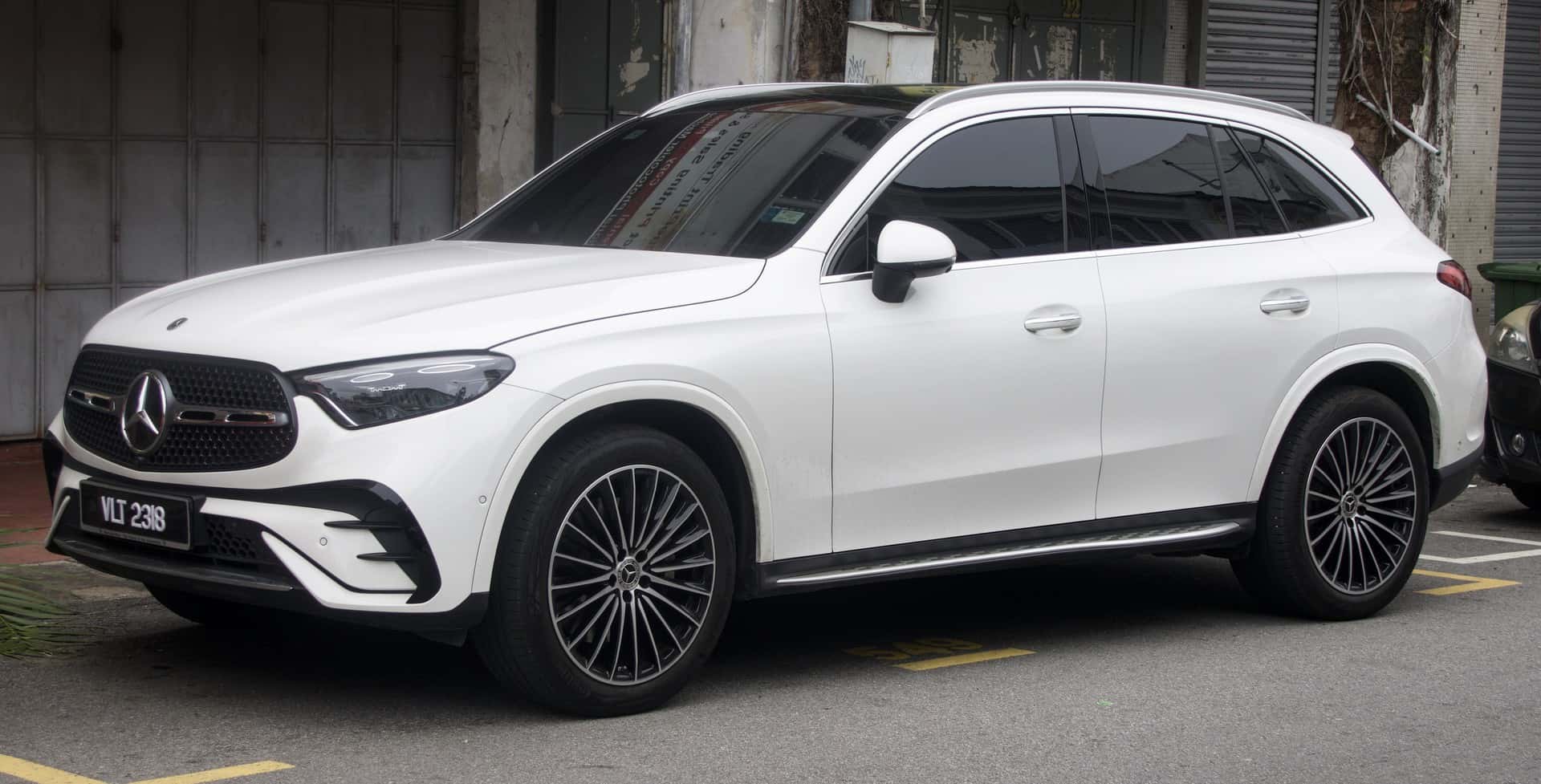 White 2023 Mercedes-Benz GLC 300 4MATIC viewed from the front and side in Malaysia