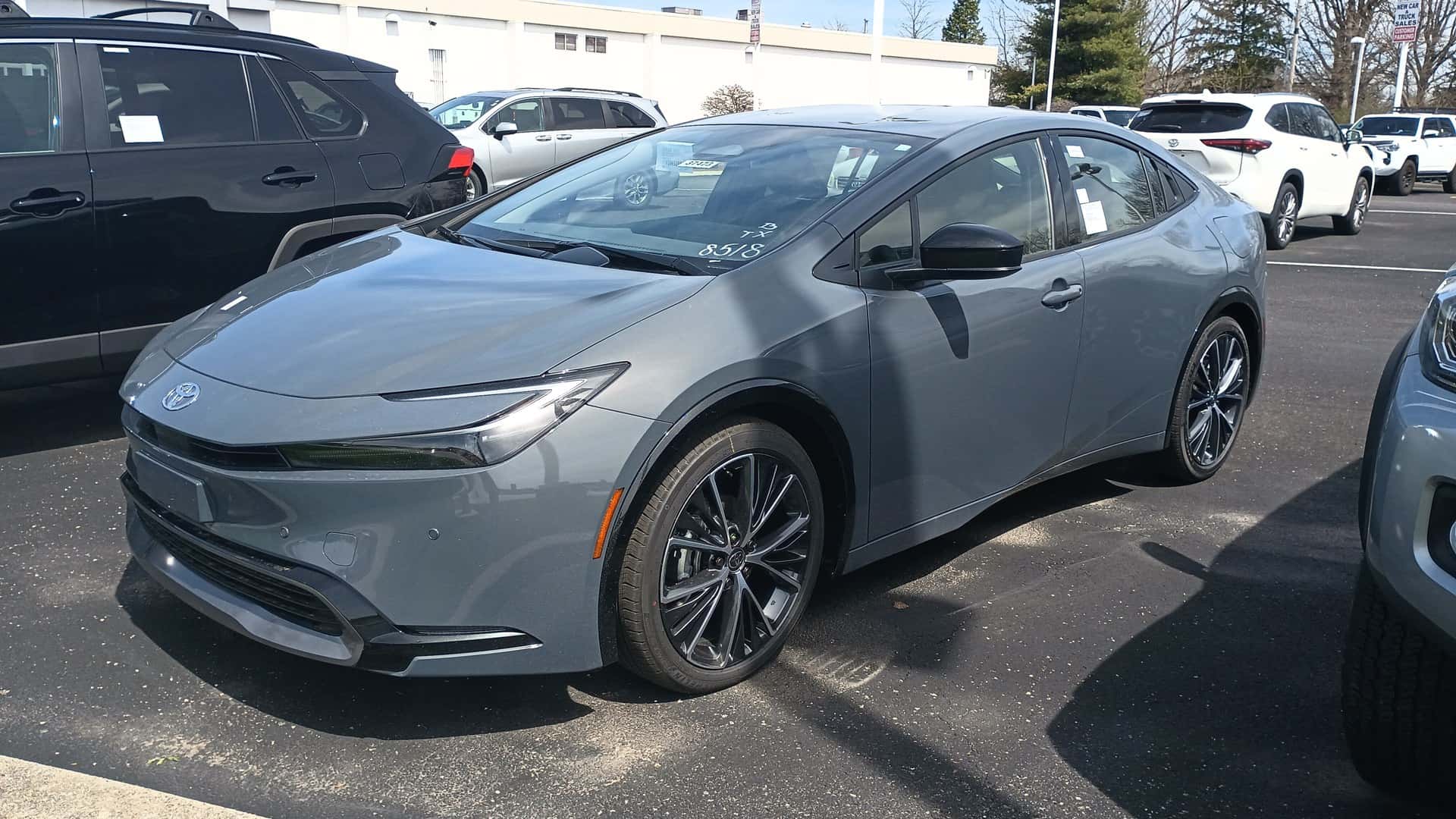 Gray 2023 Toyota Prius XLE conventional hybrid viewed from the front and side