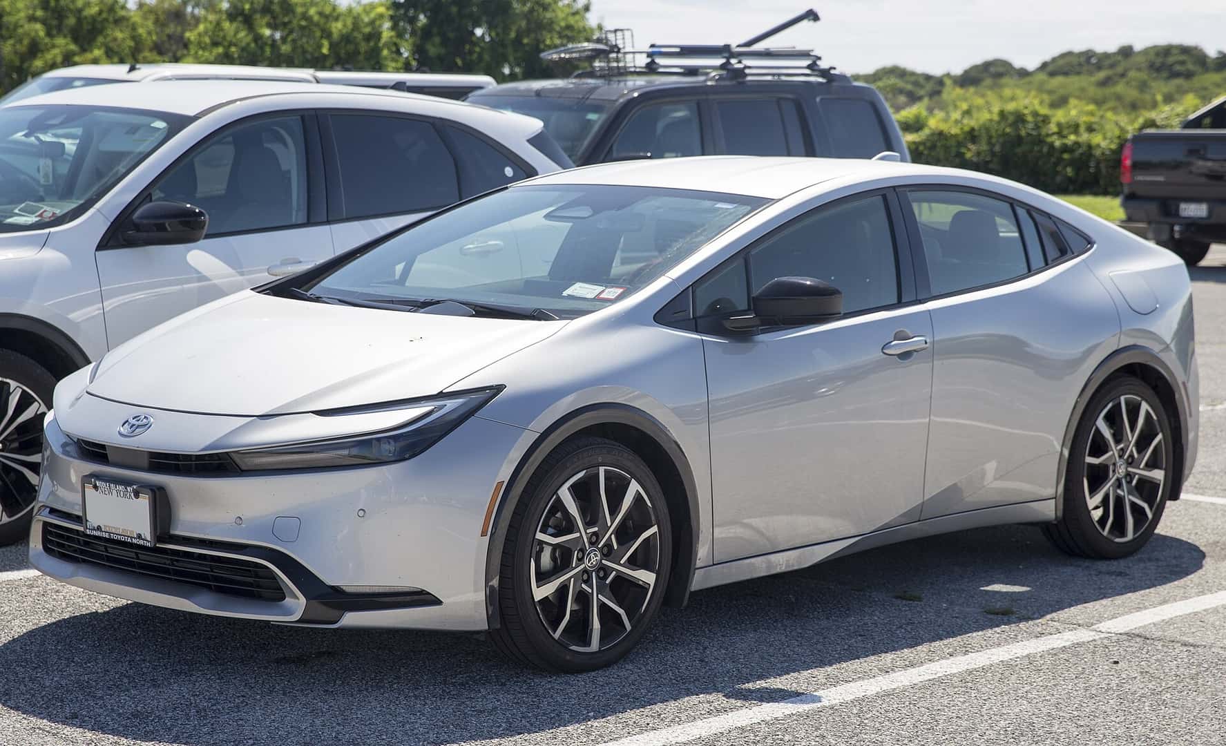Silver 2024 Toyota Prius Prime XSE plug-in hybrid viewed from the front and side