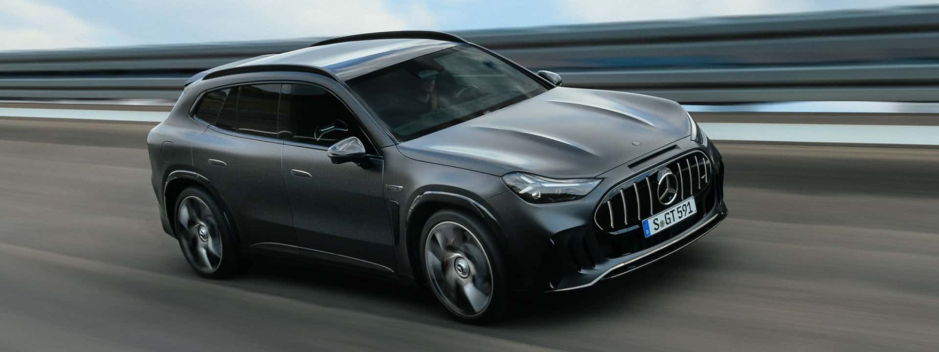 Gray Mercedes-AMG GT 55 SUV shown from the front three-quarter angle on a road, European specification reference