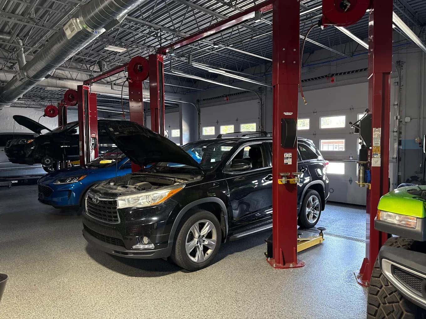 Vehicles in the service bays at Cooper Automotive