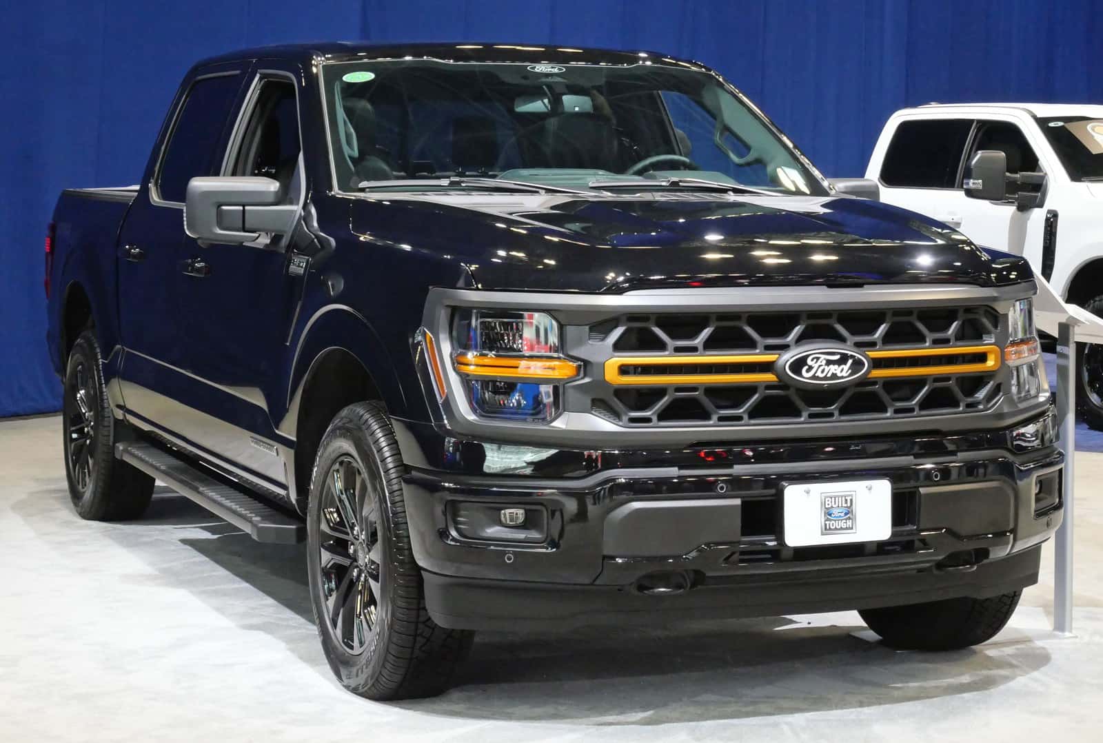 Dark blue 2025 Ford F-150 XLT Super Crew displayed at the New York International Auto Show