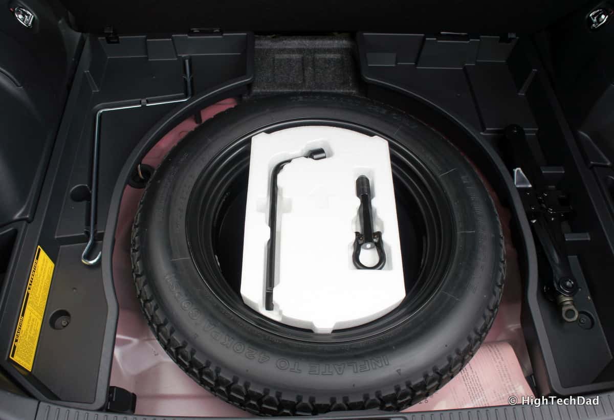Spare tire and wheel tools stored below the cargo floor in a 2014 Scion tC.