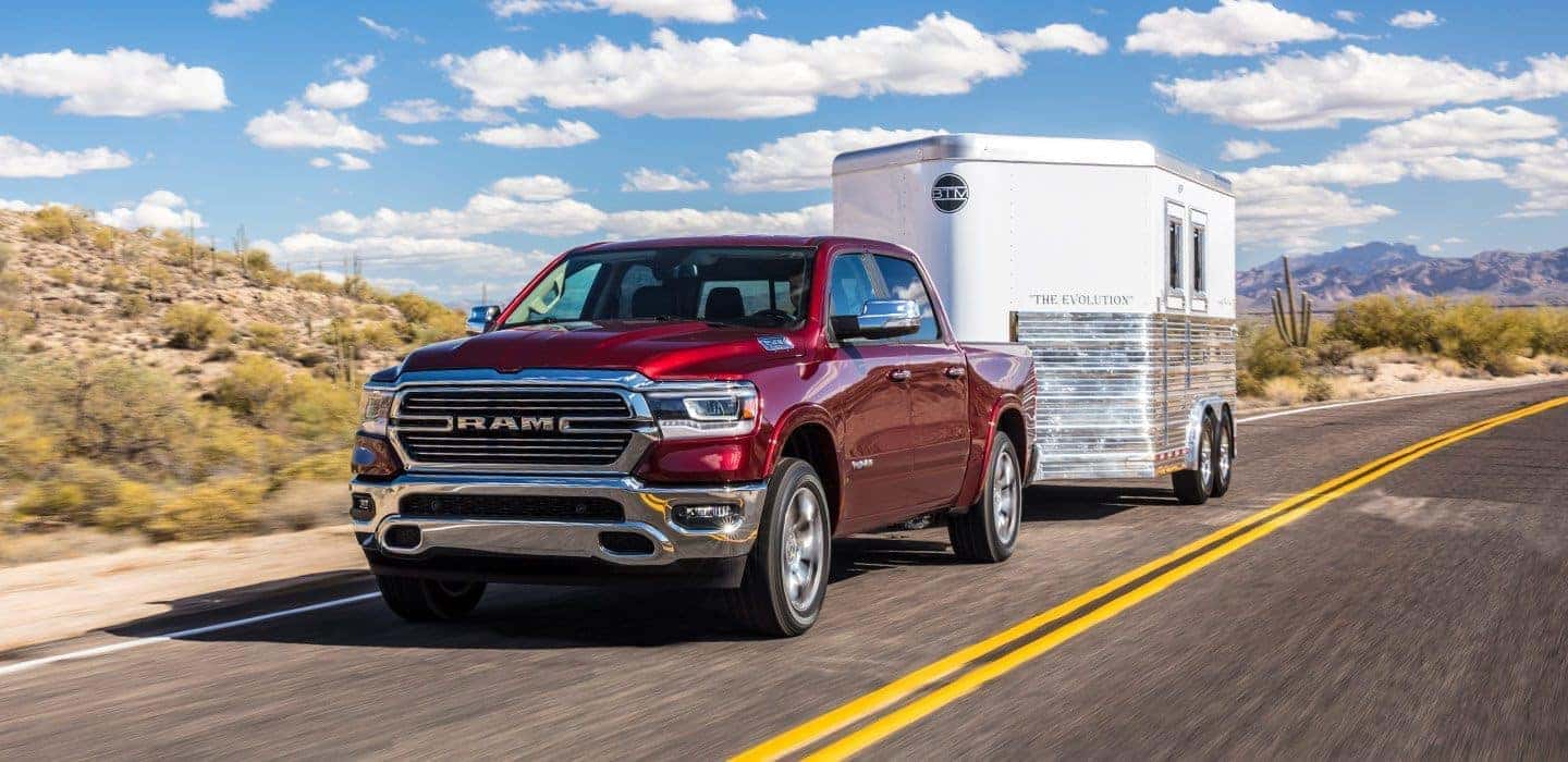 2019 RAM 1500 towing trailer down road