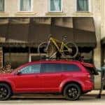 2019 Dodge Journey in red with bike on roof rack