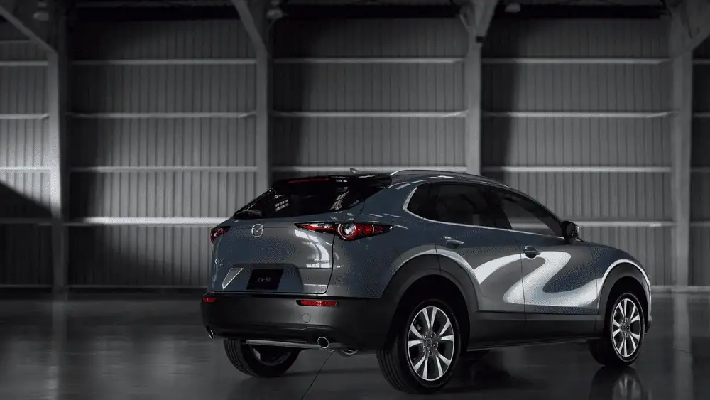 2026 Mazda CX-30 parked inside showroom with rear exterior view in Hempstead NY