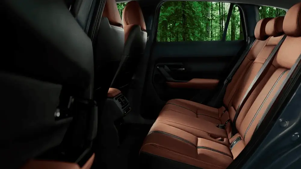 2026 Mazda CX-50 rear seating area with brown leather interior and spacious cabin in Hempstead NY
