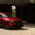 2026 Mazda CX-5 parked outside modern home showcasing stylish exterior for Hempstead NY drivers
