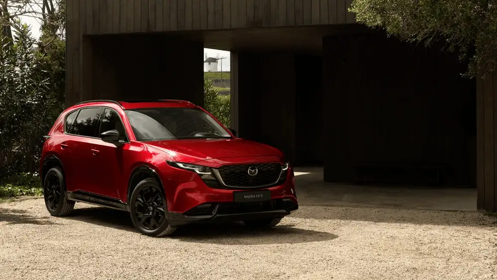 2026 Mazda CX-5 parked outside modern home showcasing stylish exterior for Hempstead NY drivers
