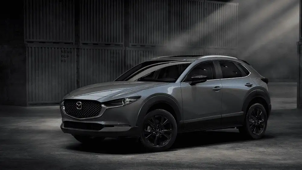 2026 Mazda CX-30 parked in industrial setting with sleek exterior near Hempstead NY