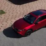 2026 Mazda CX-5 near Uniondale NY, red SUV with sunroof seen from above parked on a brick paved street