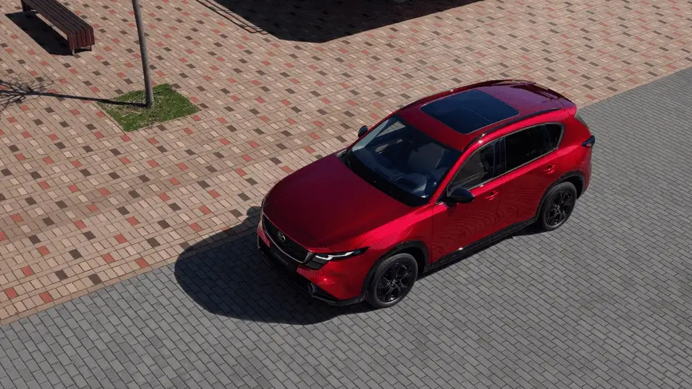 2026 Mazda CX-5 near Uniondale NY, red SUV with sunroof seen from above parked on a brick paved street