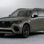 2026 Mazda CX-70 for Uniondale NY drivers, olive green SUV shown front and side view on plain studio background