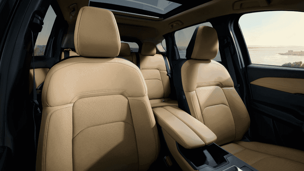 2026 Mazda CX-5 near Hempstead NY, beige leather front and rear seats with open sunroof and coastal water view through side windows