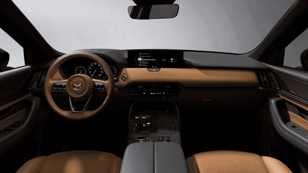 2026 Mazda CX-70 near Hempstead NY, tan leather dashboard with Mazda steering wheel, infotainment screen, and automatic gear selector