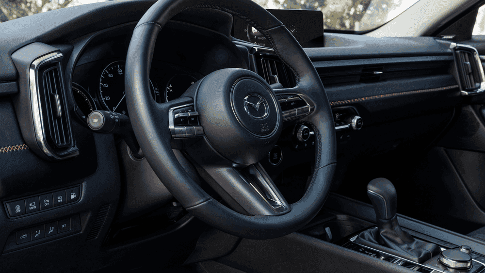 2026 Mazda CX-50 Hybrid black leather interior with steering wheel near Uniondale, NY.