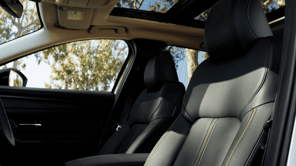2026 Mazda CX-50 Hybrid black leather seats with sunroof and orange stitching near Uniondale, NY.