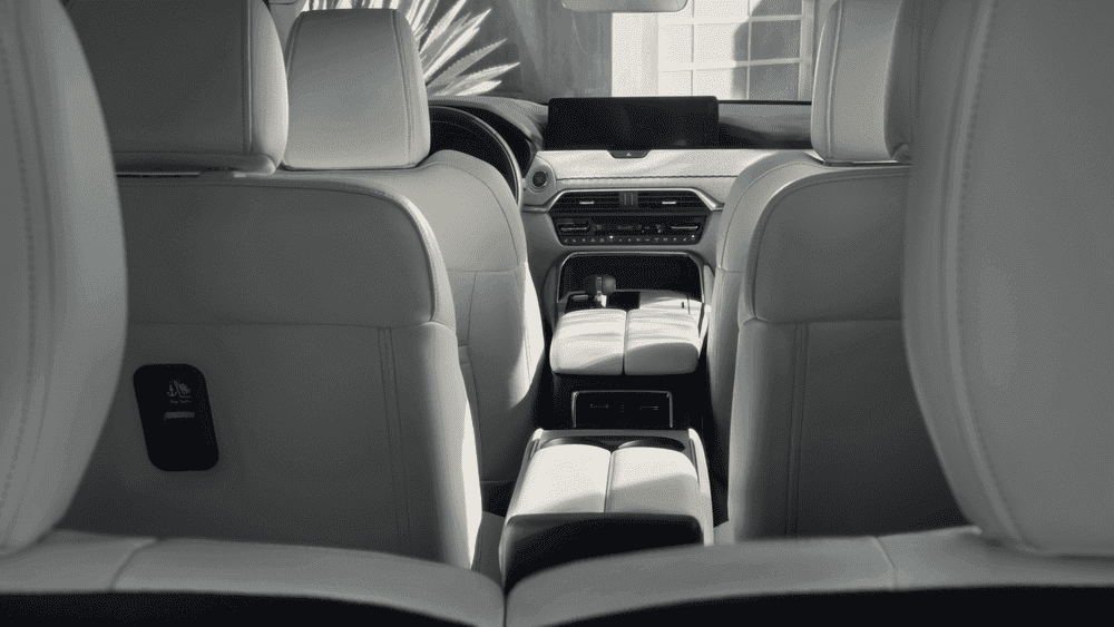 2026 Mazda CX-90 Plug-In Hybrid white leather rear seats and console near Uniondale, NY.
